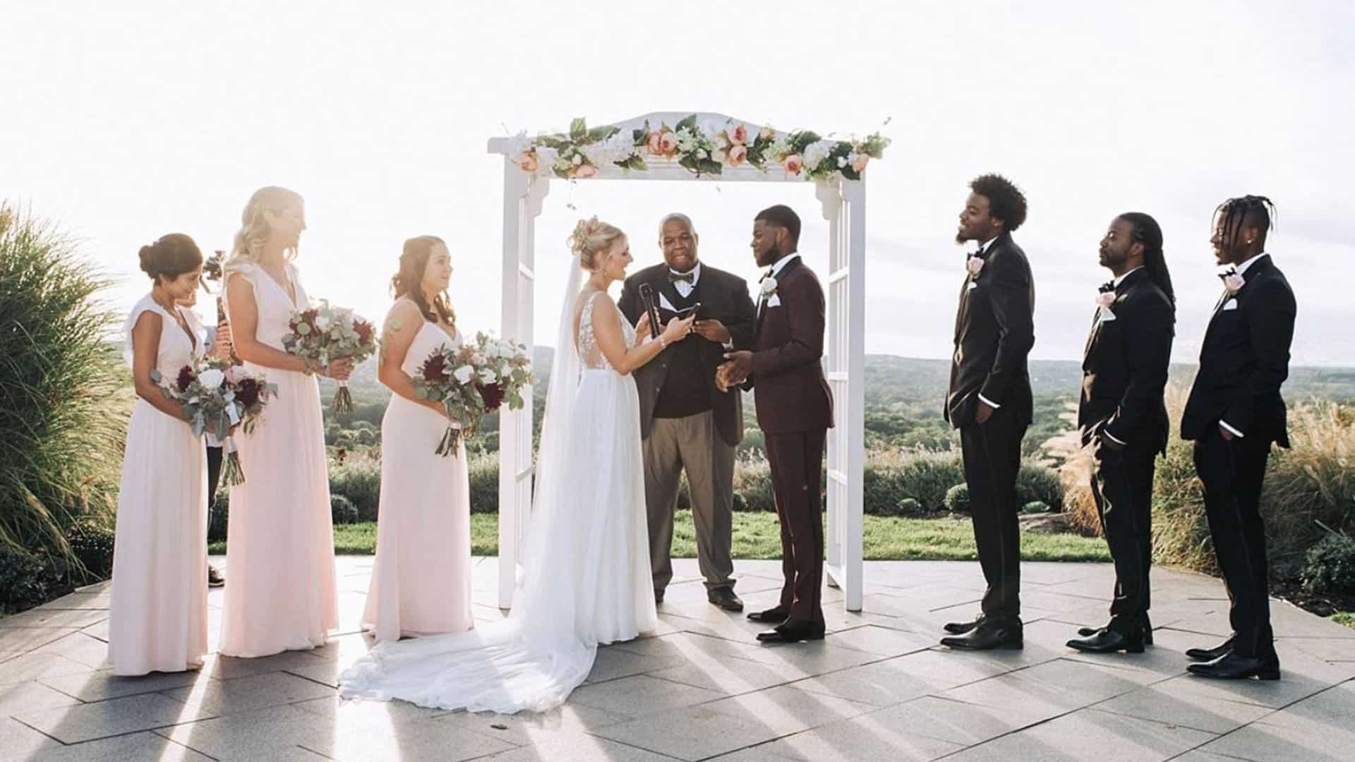 a group of people standing around each other