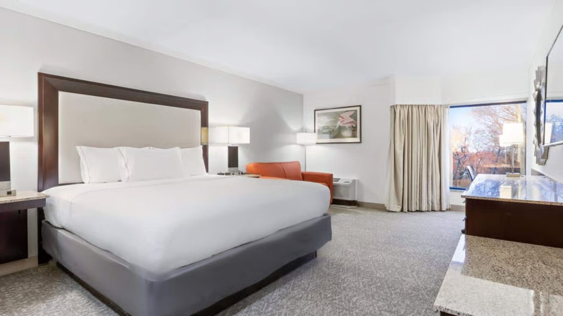 Executive Cliffside king guest room at Woodcliff Hotel & Spa with an autumn hilltop window view